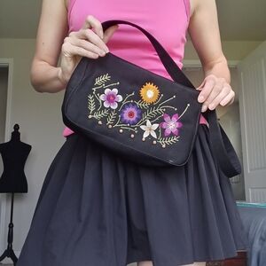Vintage inspired Black and floral embroidered purse with silver hardware.